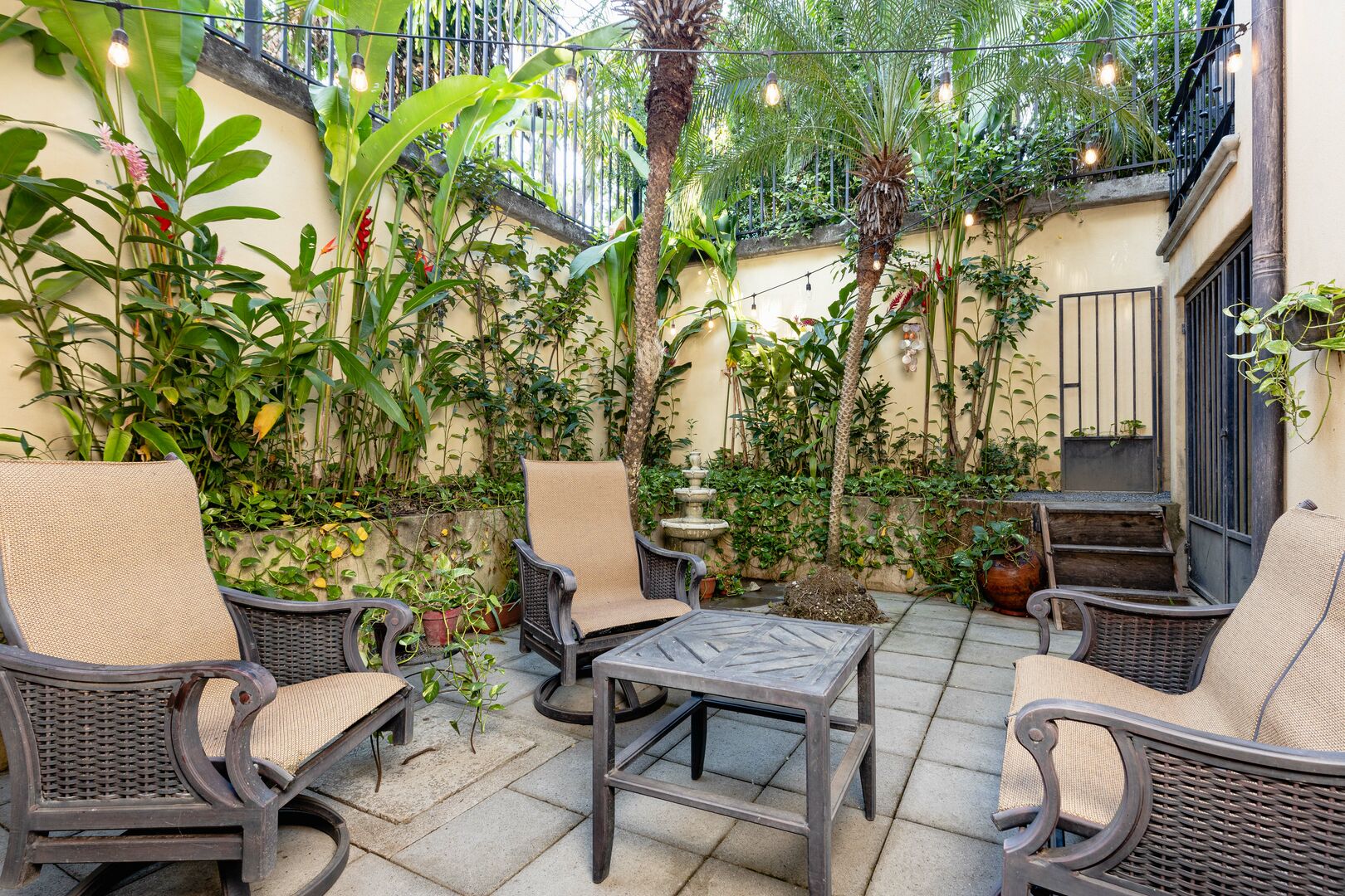 Escape to the kitchen's private garden patio for moments of peaceful solitude amidst lush surroundings.