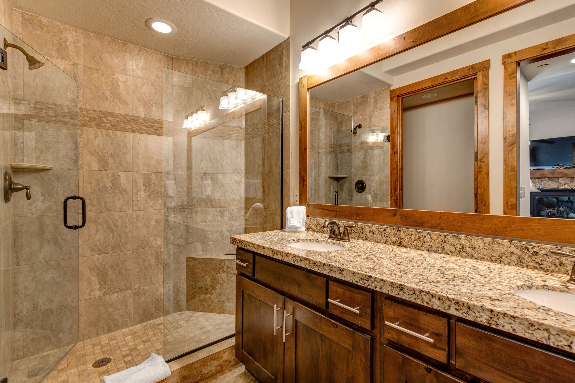 Lower Level Master 2 Bathroom with dual sinks and large tile shower
