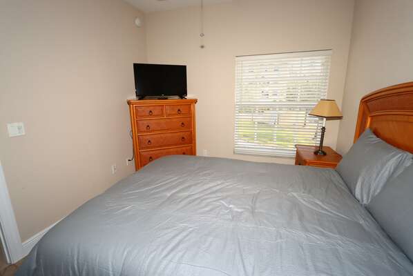 Guest Bedrrom 1 with Queen bed and TV