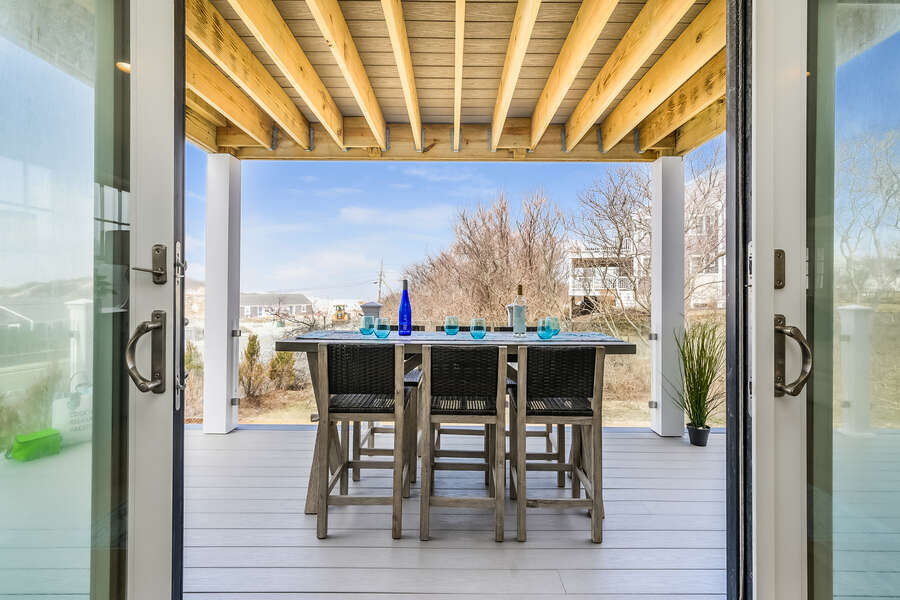 From the dining room sliders out to the deck for outdoor meals! - 74 E Bay View Road Dennis Cape Cod - New England Vacation Rentals