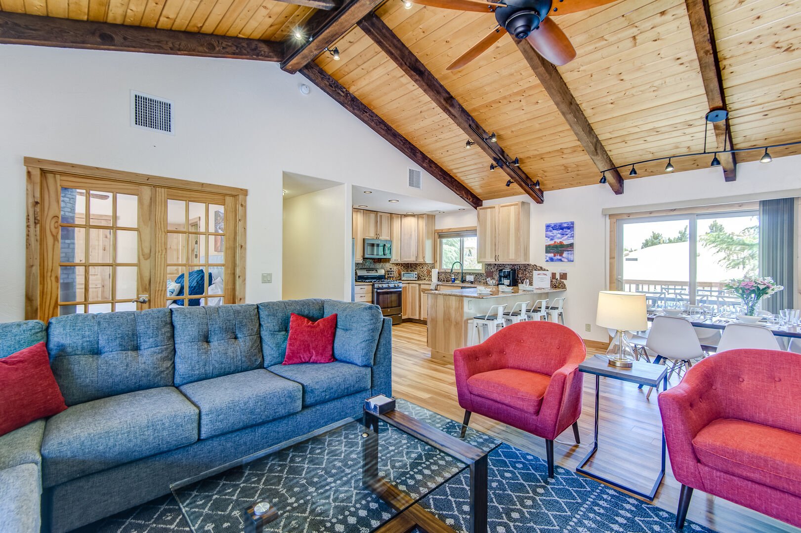 Great Room with Wood Floors and Vaulted Wood Beam Ceilings Throughout