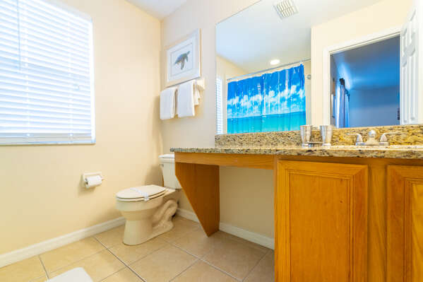 Master bathroom 1 (upstairs) has a bath/shower combo and single basin vanity