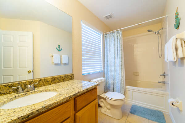 Bedroom 3 en-suite has a bath/shower combo and single basin vanity (upstairs)
