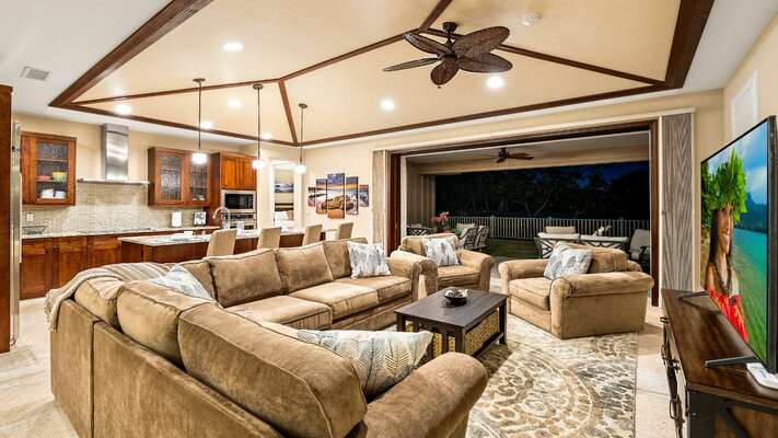 Living area includes a ceiling fan and direct open lanai access
