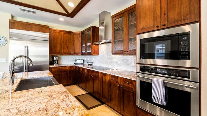 Kitchen has stainless steel appliances and all the amenities you need to cook and prepare meals
