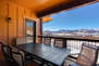Private Patio off Living Room with seating for six, breathtaking ski-resort view, and large BBQ Grill