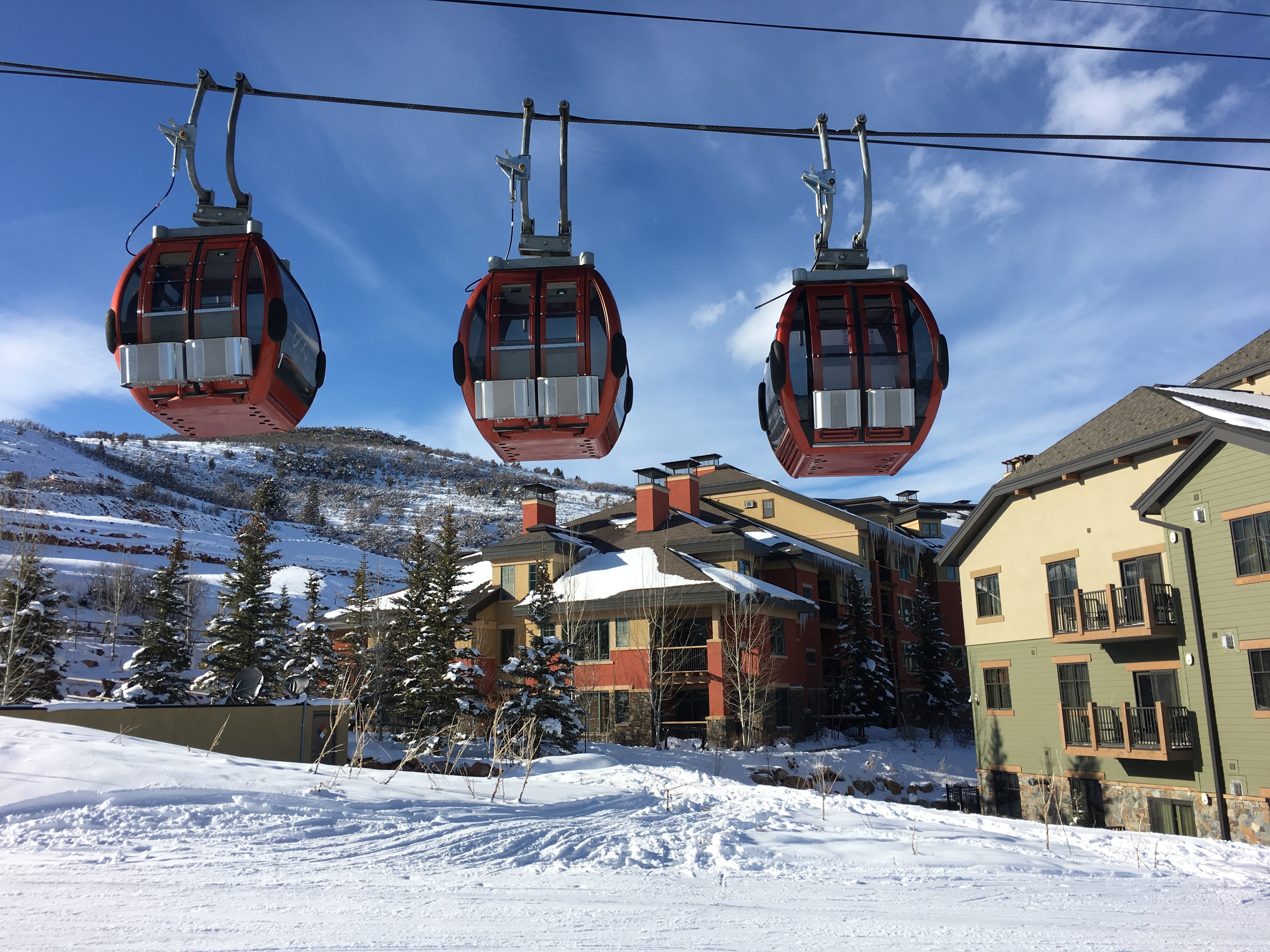 Enjoy a premier ski in ski out location -- gondola and slope in foreground, property in directly behind