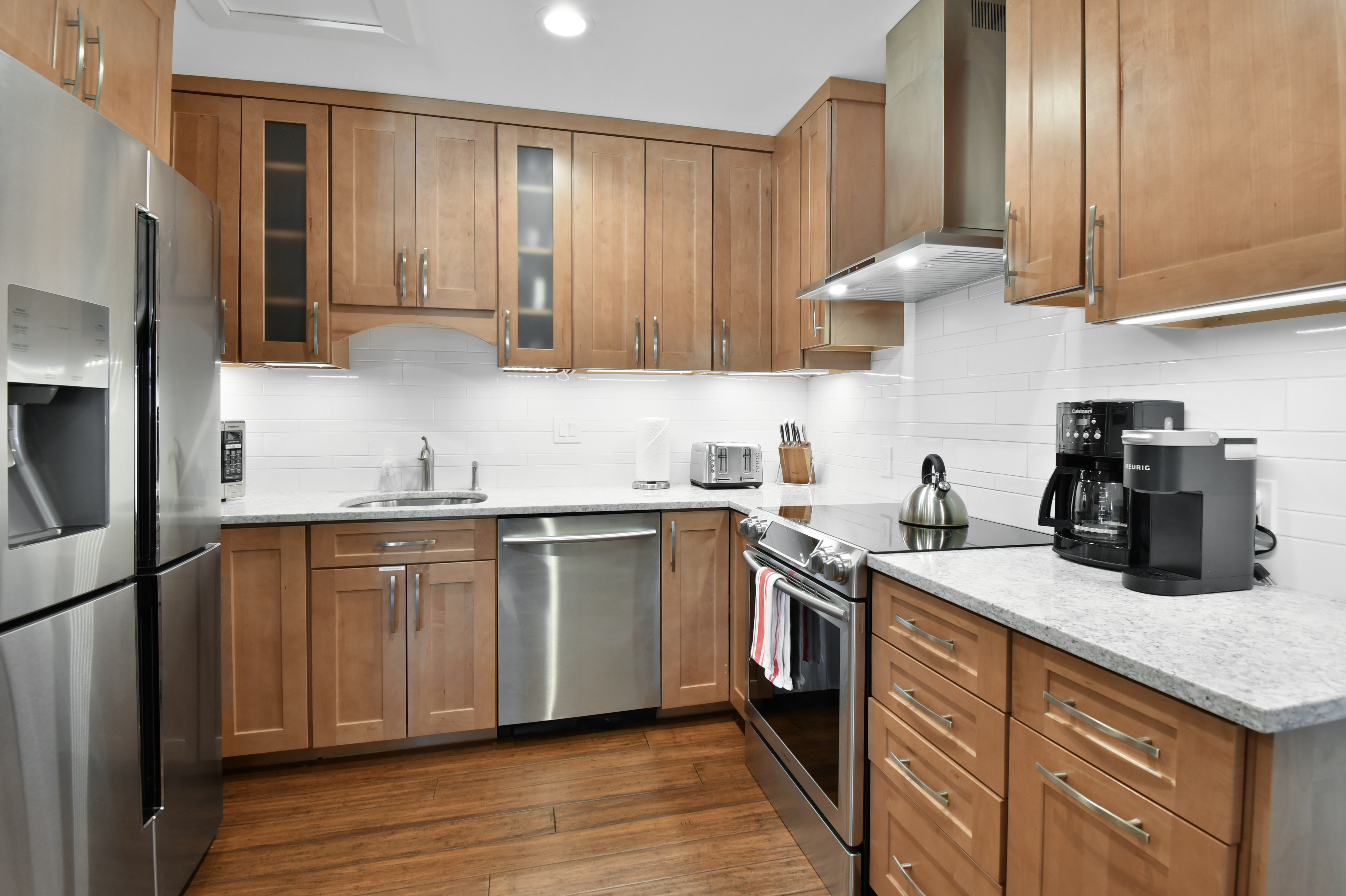 Luxurious kitchen with granite countertops and stainless steel appliances.