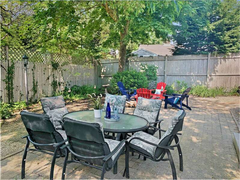 Back yard with outdoor seating and firepit -50 Foster Road Hyannis Cape Cod- New England Vacation Rentals