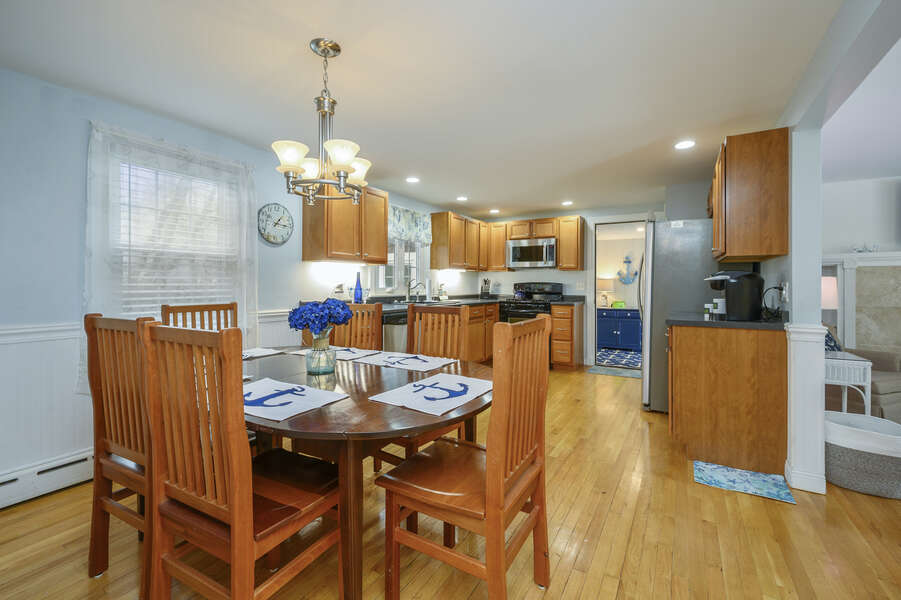 Dining area looking into spacious kitchen and doorway to sunroom-50 Foster Road Hyannis Cape Cod- New England Vacation Rentals