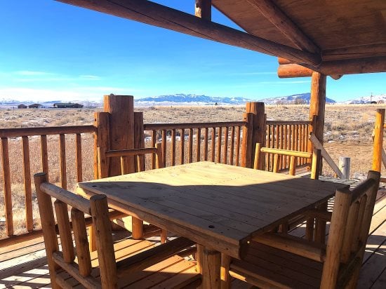 Deck with dining area and great Beartooth Mountain view