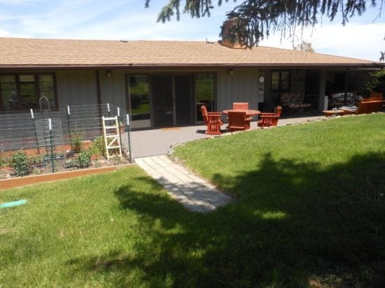 Gorgeous spacious backyard with large patio & featuring fully fenced yard perfect for children or your furry travel companion