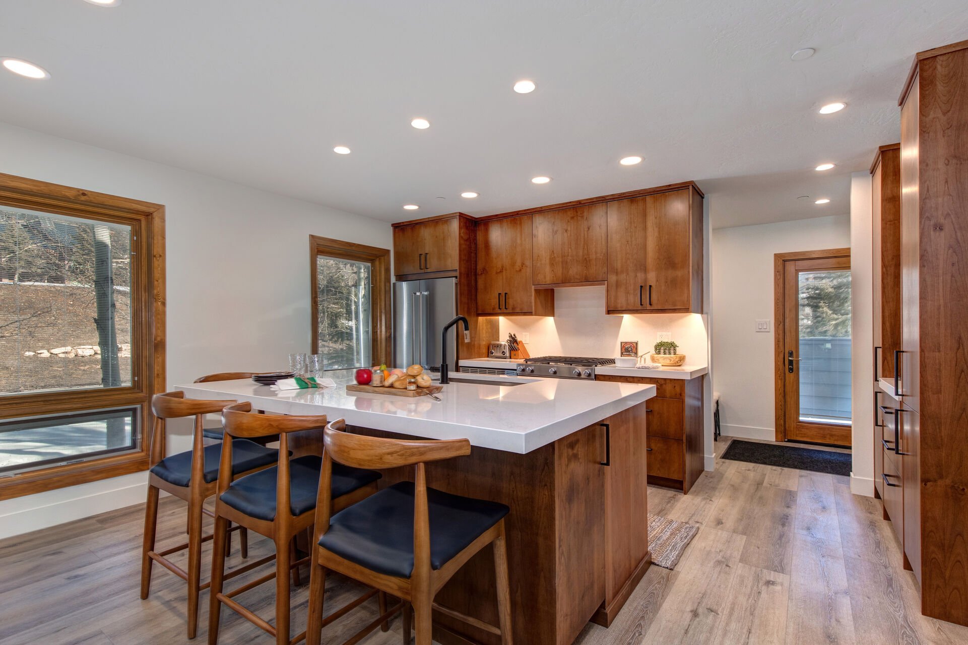 Fully equipped kitchen with new appliances, and Quartz countertop and bar seating for four