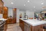Fully equipped kitchen with new appliances, cabinets, Gas cooktop, electric oven and baking drawer and Quartz countertop