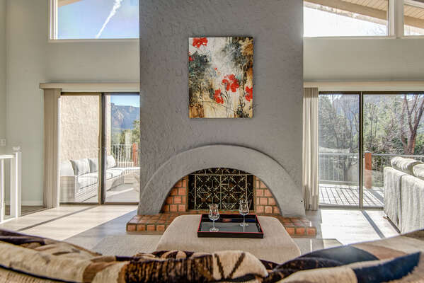 Main Level Living Room with a Gas Fireplace and Plenty of Natural