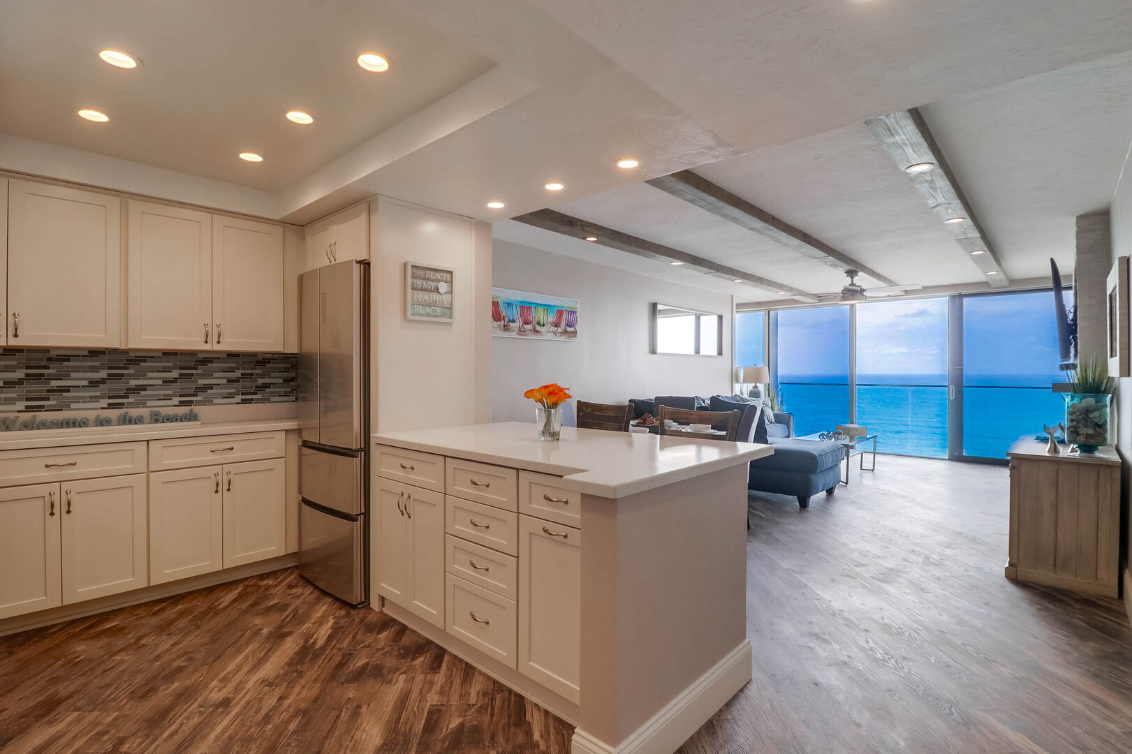 Kitchen with stainless steel appliances, quartz countertops, recessed lighting, and a view