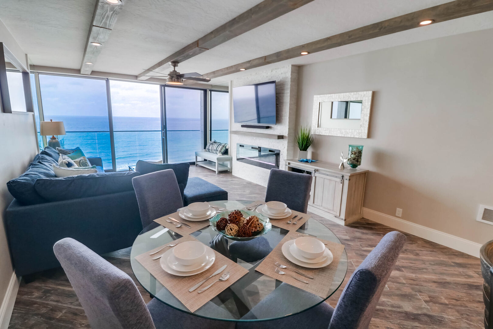 Open floor plan with dining area for 4, living room, kitchen and ocean views