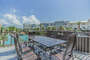 LARGE TERRACE FOR DINING AND LOUNGING.  VIEWS OF THE RESORT POOLS AND GULF OF MEXICO.