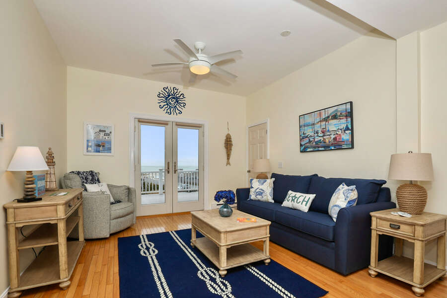 Comfy living room with sliders to deck overlooking Bank Street Beach - 25 Bank Street Unit #2 Harwich Port - New England Vacation Rentals- Harwich Port -Cape Cod- New England Vacation Rentals