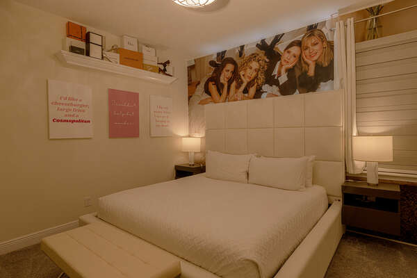 This fashionista-themed bedroom is furnished with a king-sized bed, 55-inch 4k SMART TV, and an en-suite bathroom.