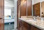 Master Bathroom with jack-n-jill access from Main Living Area, stone countertops, and large tiled shower
