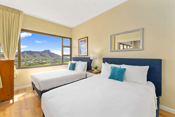 Relax in the bedroom with 1 queen-size and 1 full-size bed with a stunning Diamond head view!