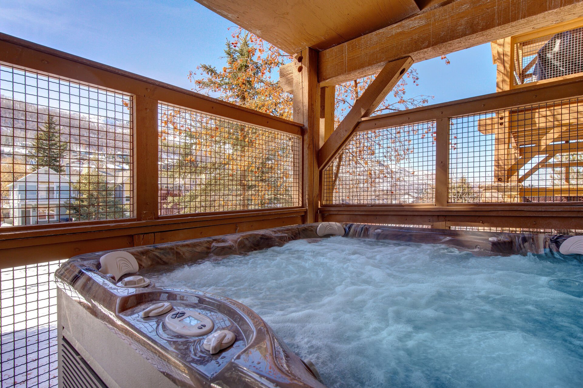 Private Patio with hot tub, bbq grill, and stunning views of surrounding Old Town Park CIty
