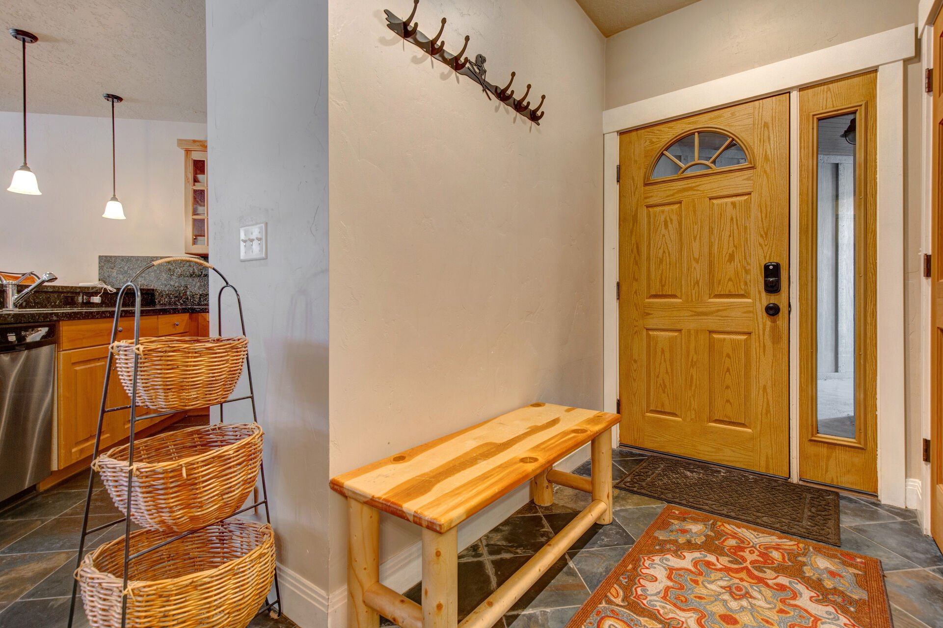 Front Entryway with coat hooks and convenient bench