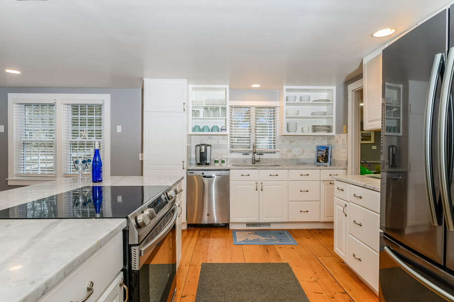 Modern kitchen with stainless appliances and center cooking island-75 Pinewood Rd Hyannis Cape Cod- New England Vacation Rentals