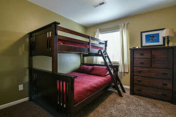 Bedroom with Twin over Full Bunk Bed and Dresser.