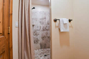 Shower, Curtain Shower, and Towels in Our Moab Utah Condo Rental.