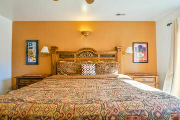 master bedroom with a king bed