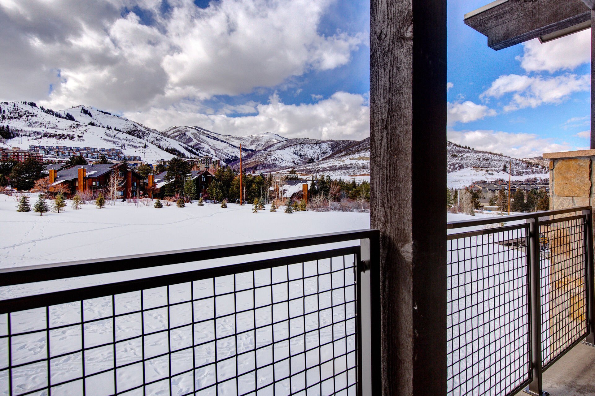 Private Patio with BBQ Grill, seating, and a view of the 13th hole and Canyons Resort