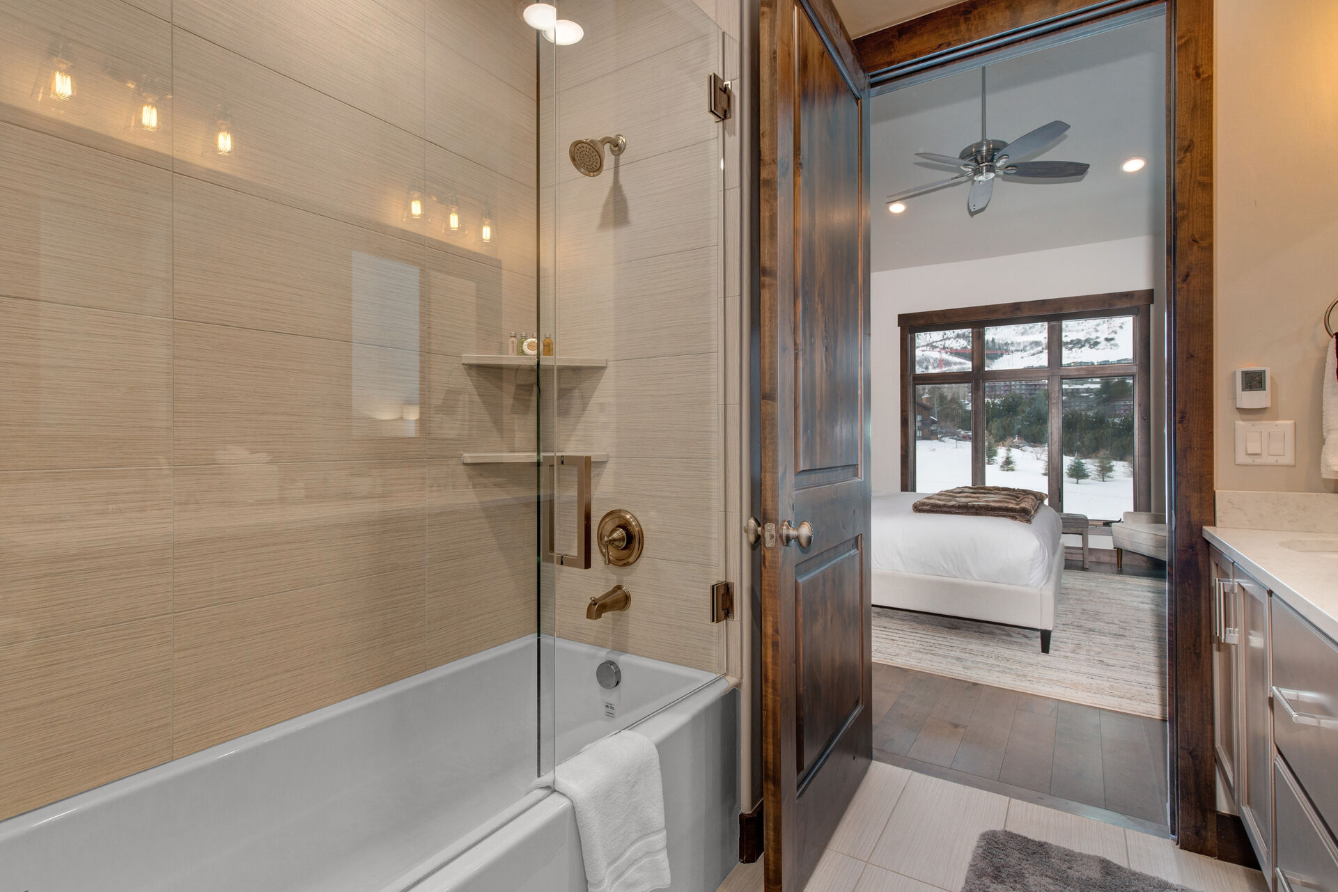 Bedroom 2 Bathroom with dual vanities and tub/shower combo