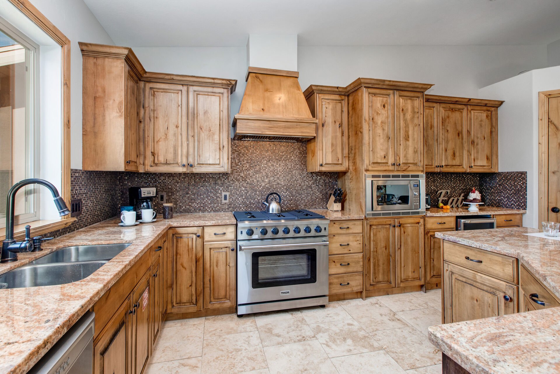Spacious Kitchen with Plenty of Cabinets and Granite Counters