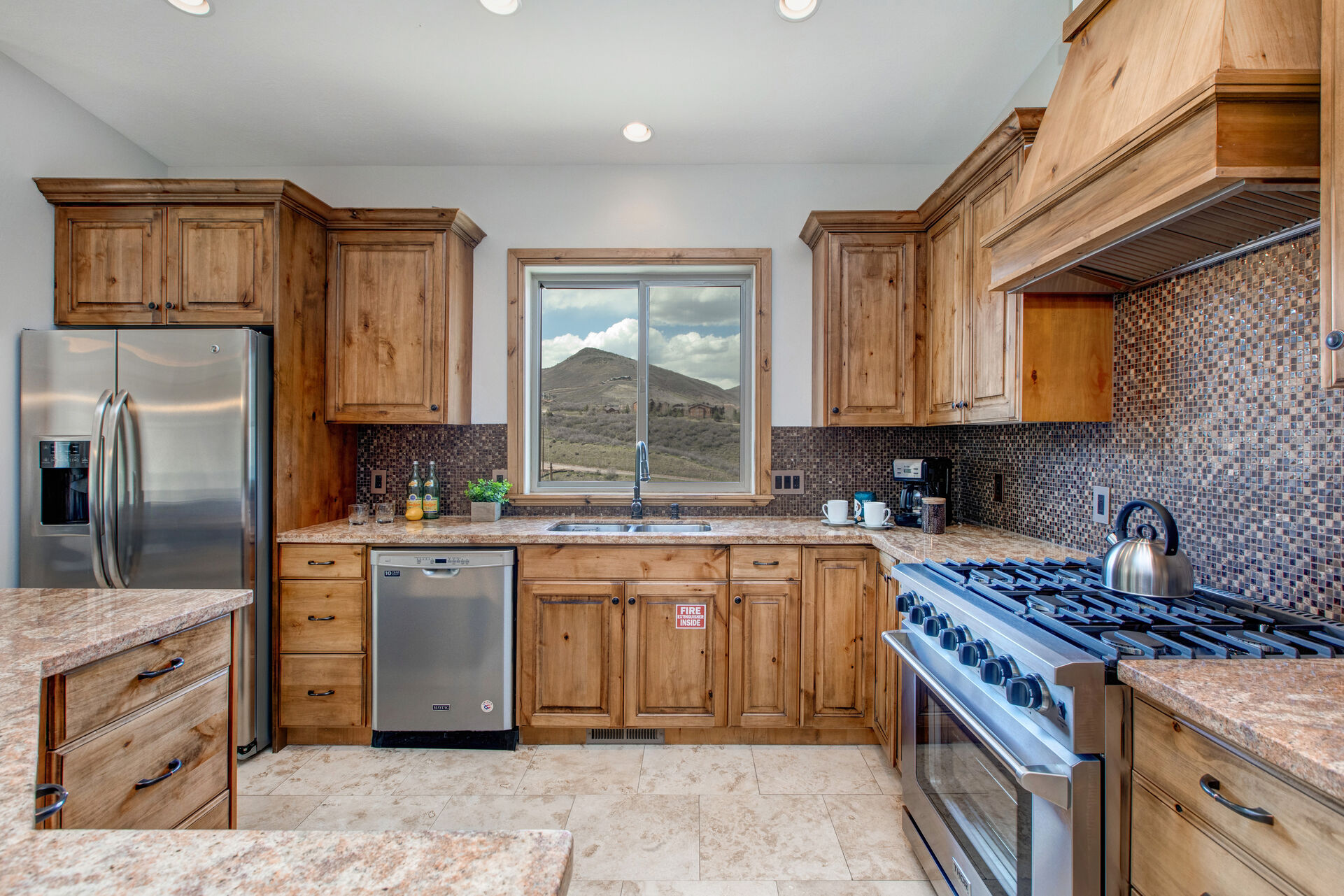 Fully Equipped Kitchen Offering Stainless Steel Appliances, Including a New Thor Gas Range