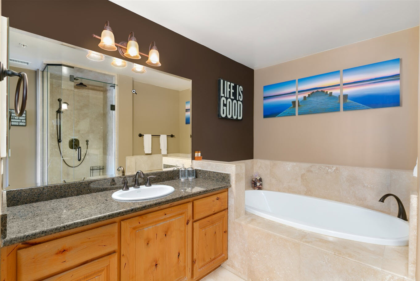 Upstairs master bathroom with large vanity, walk-in shower and separate tub