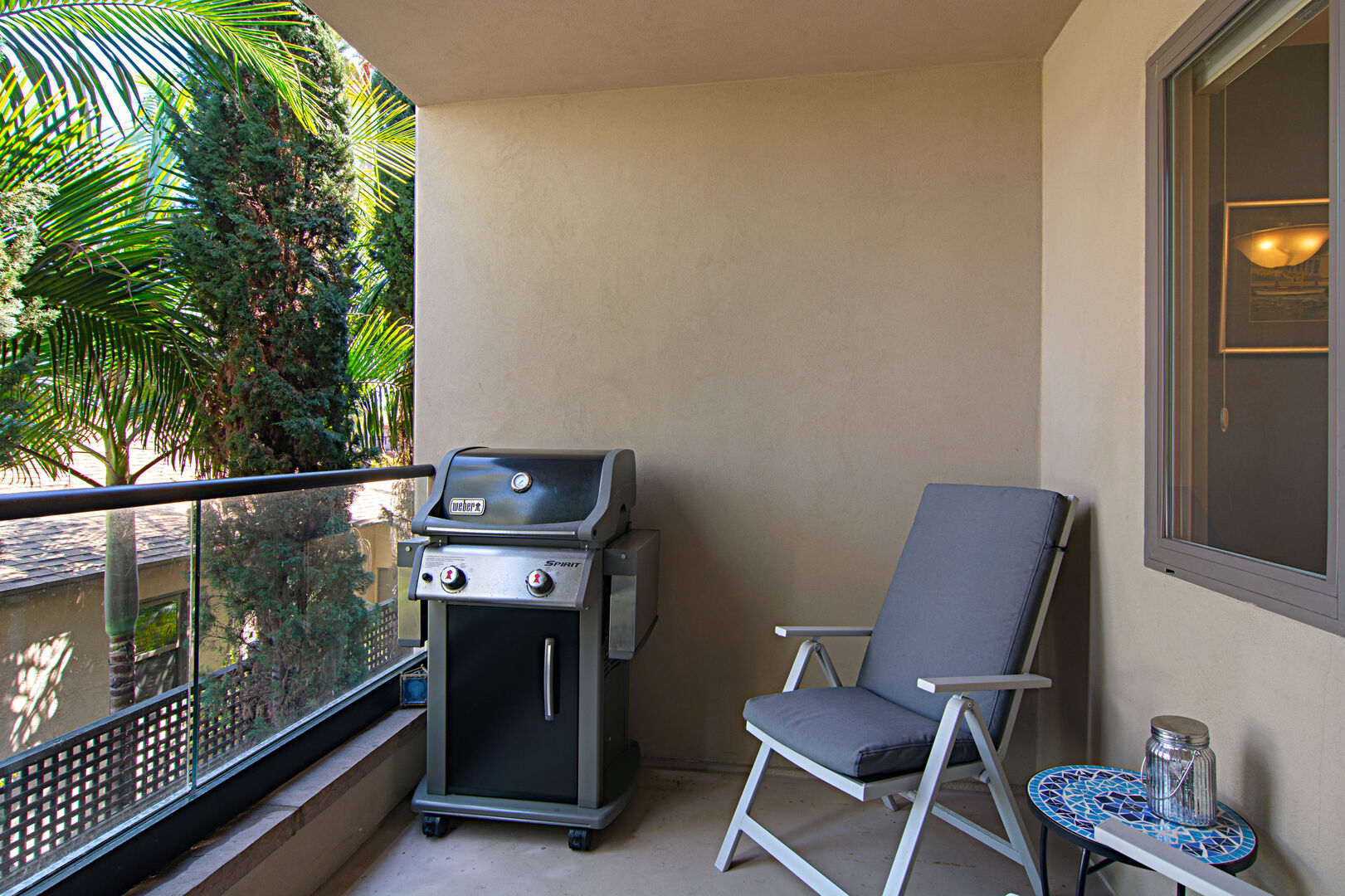 Lower balcony with seating for 2 and BBQ grill