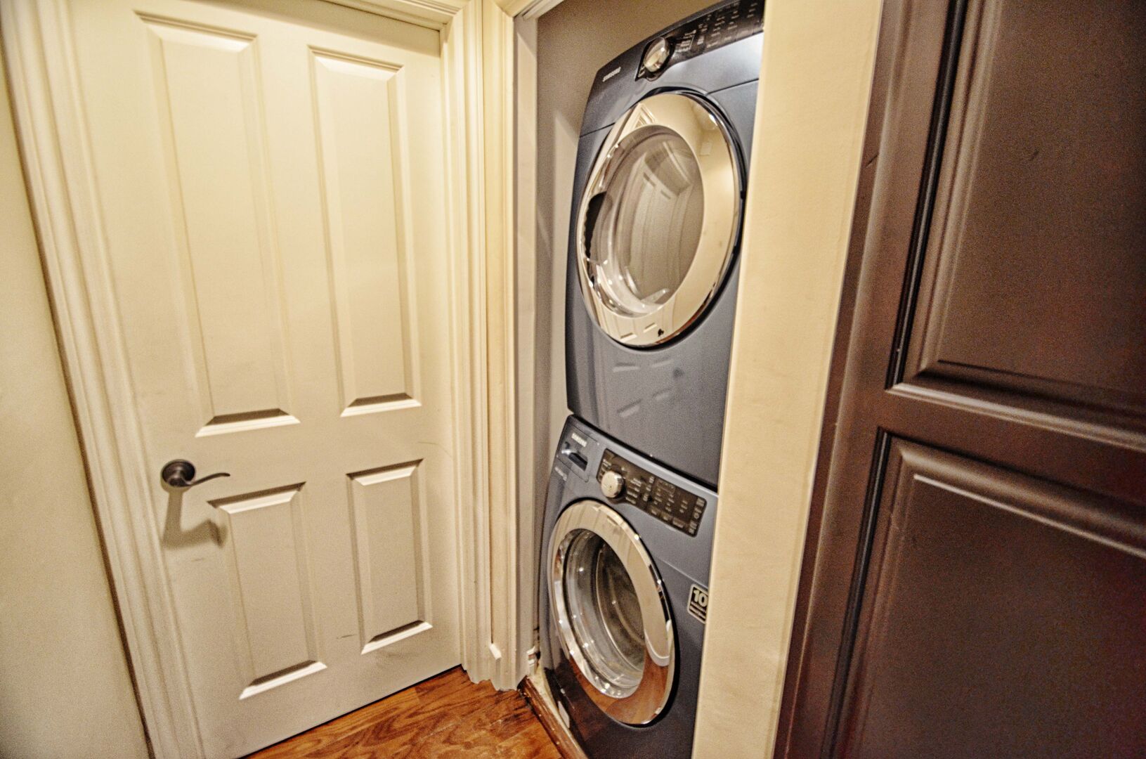 Stackable washer and dryer upstairs between guest and master bedrooms