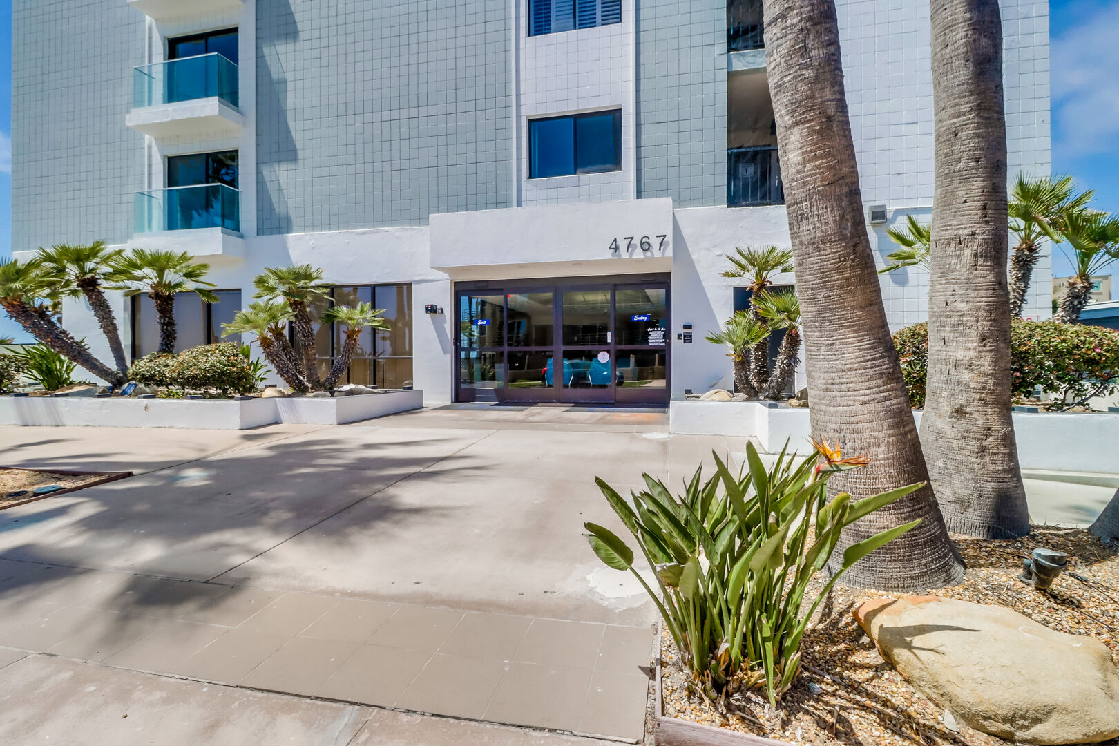 Capri by the Sea front entrance. Gated parking garage with upper and lower levels and assigned parking can be accessed with a guest key fob. In addition, the fob opens the lobby door and moves the elevators (North and South) to the condo level