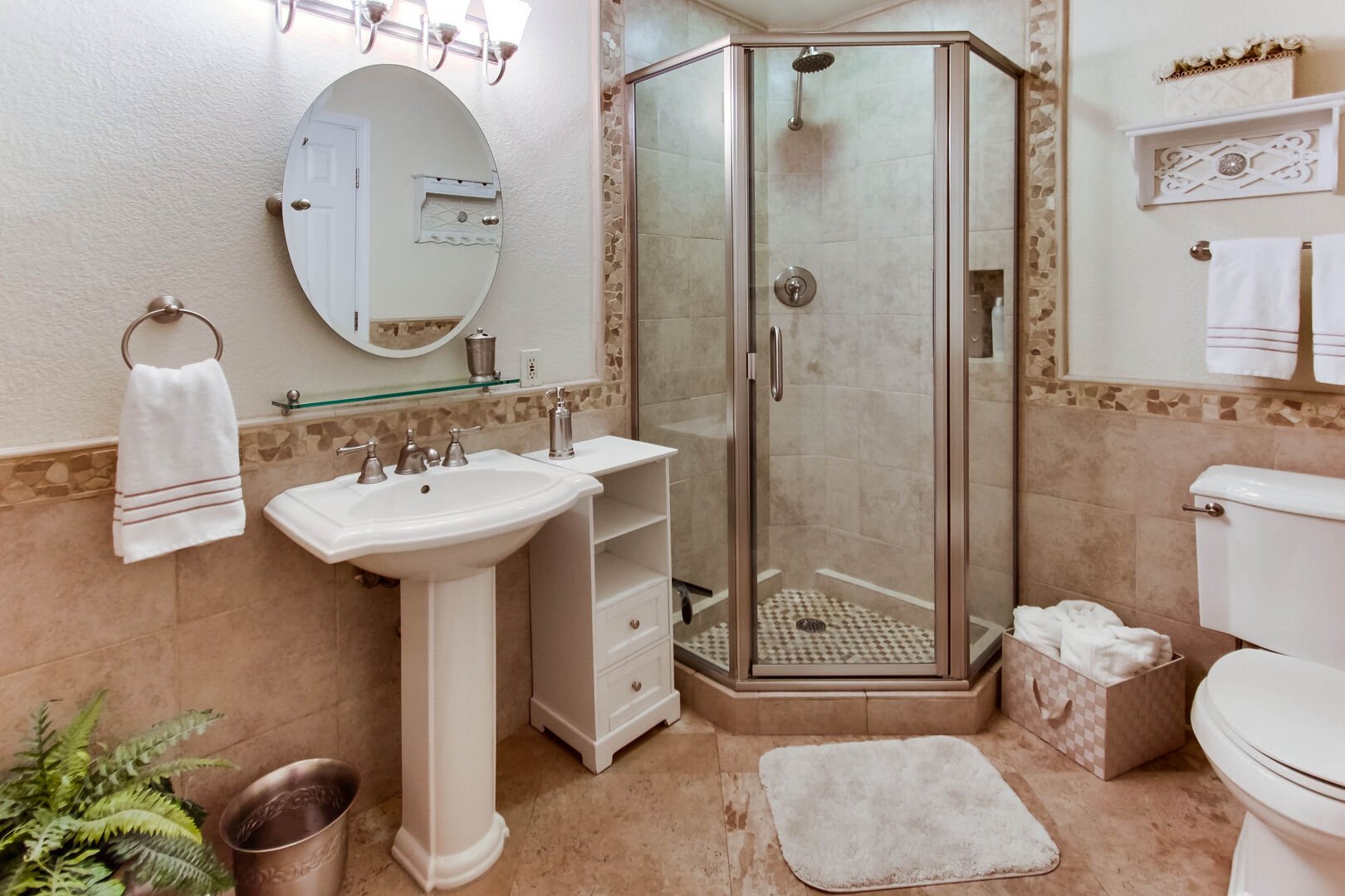 Master bathroom with rain shower head, toilet and vanity