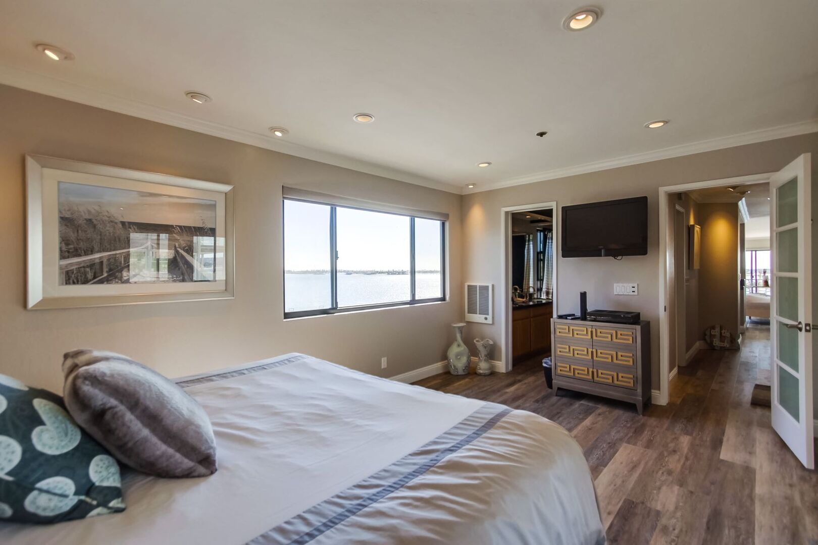 Master bedroom with king size Tempur-pedic mattress, recessed lighting, dresser storage, and Cable TV