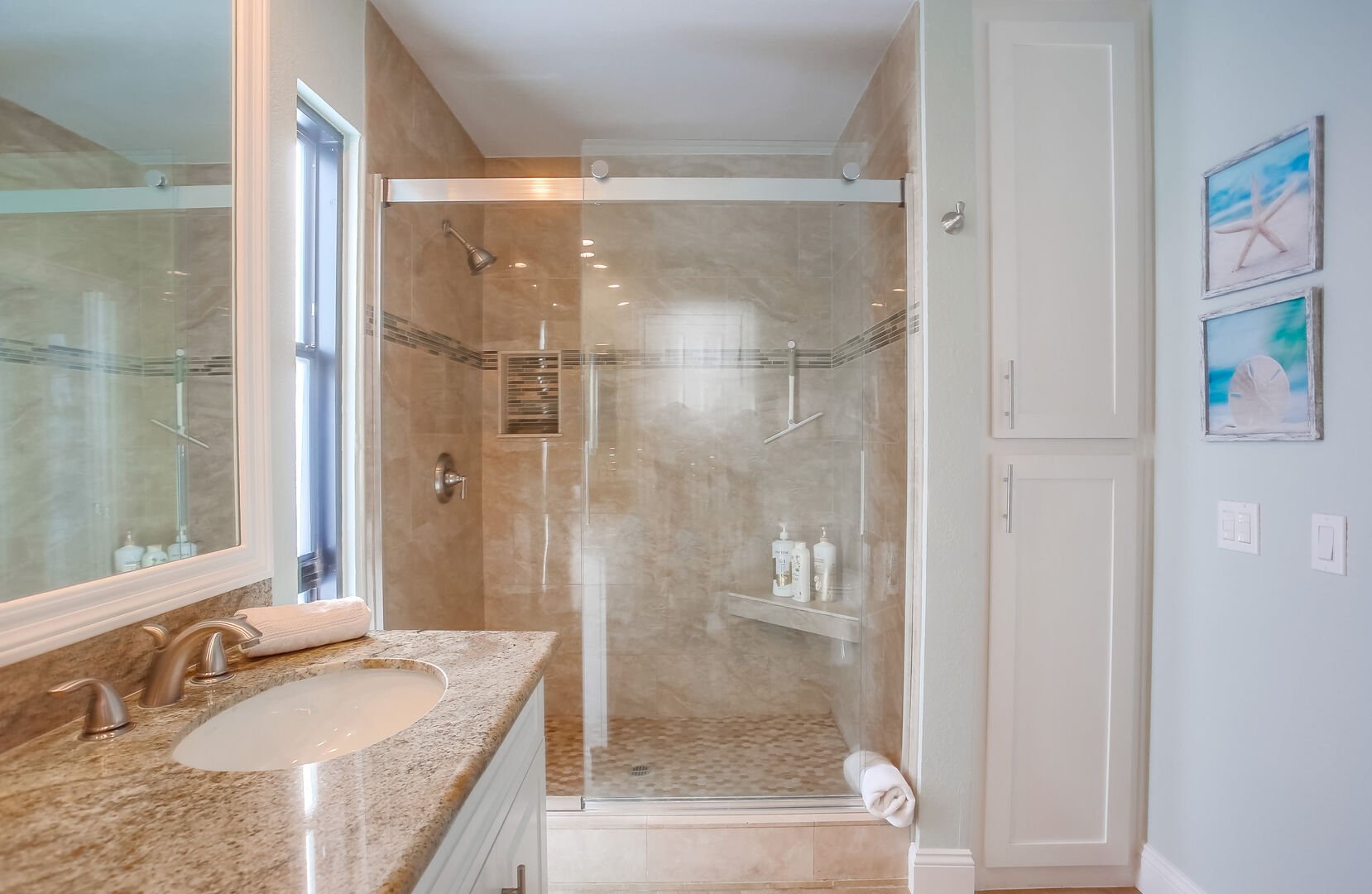 In-suite and shared bathroom with all new walk-in shower, dual vanity, countertops, cabinets, flooring and light fixtures!