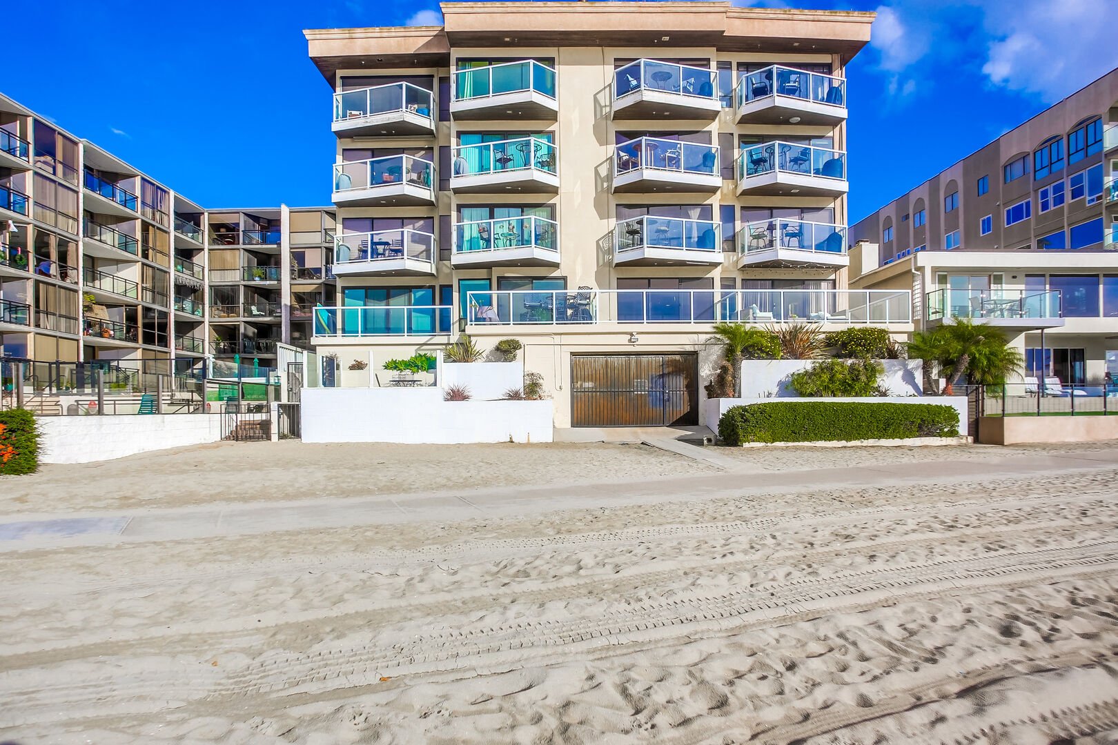 Backside of Riviera Villas from the shores of Mission Bay. Immediate beach access from gated garage. All condos from this position have balconies facing the bay, including 204!