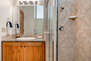 Master Bathroom with two separate vanities and large tiled shower