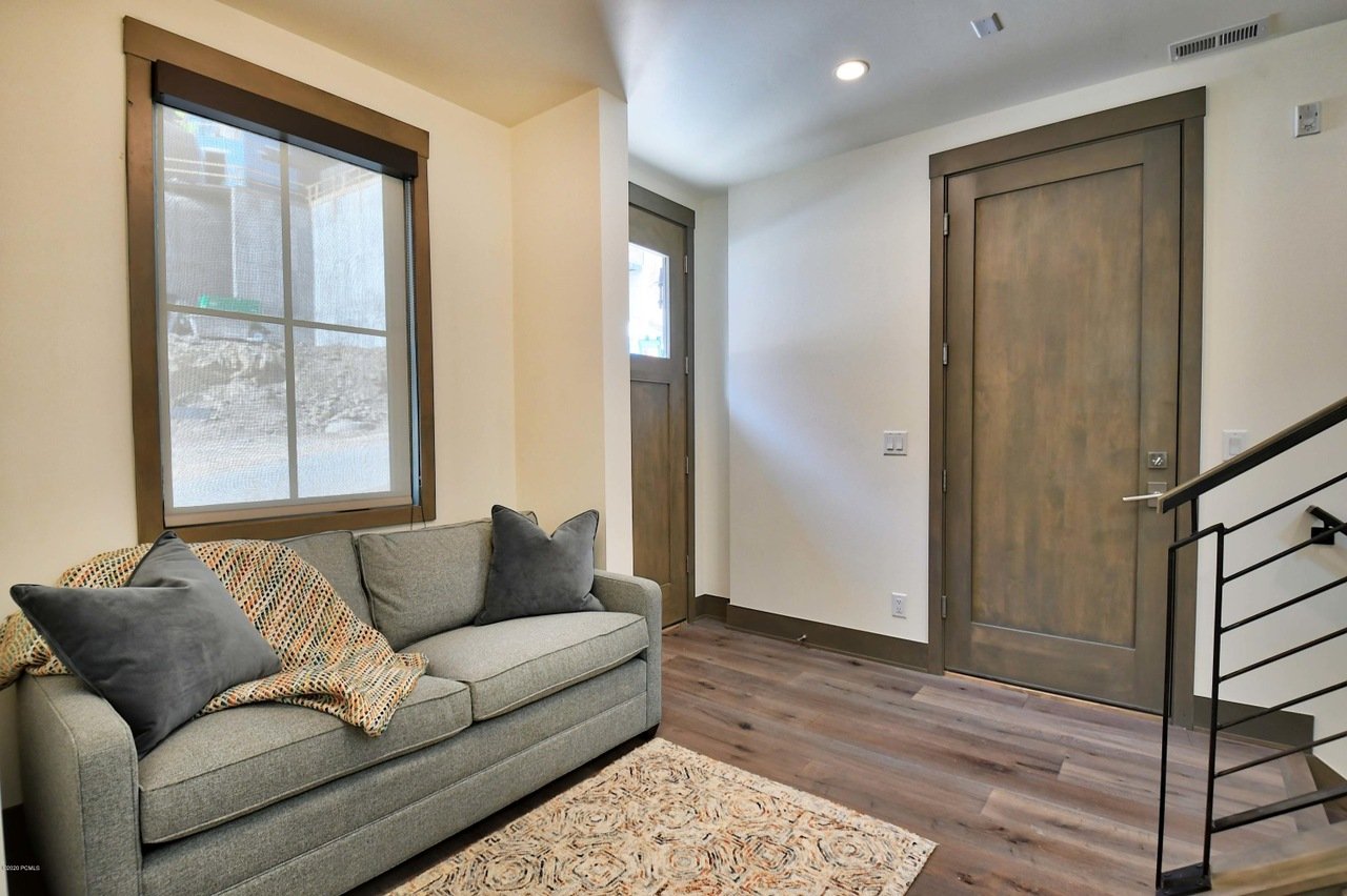 Front and Garage Door Entry on the Main Level - New Entryway Offers a Bench and Coat Racks