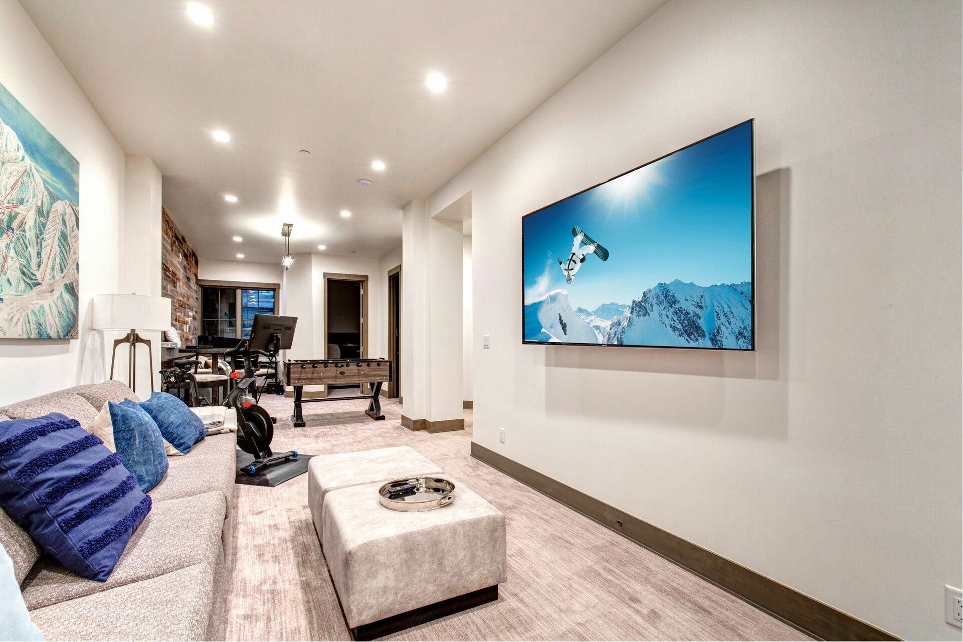 Family room on the lower level, Smart TV with Roku & Youtube TV, Foosball table and Peloton