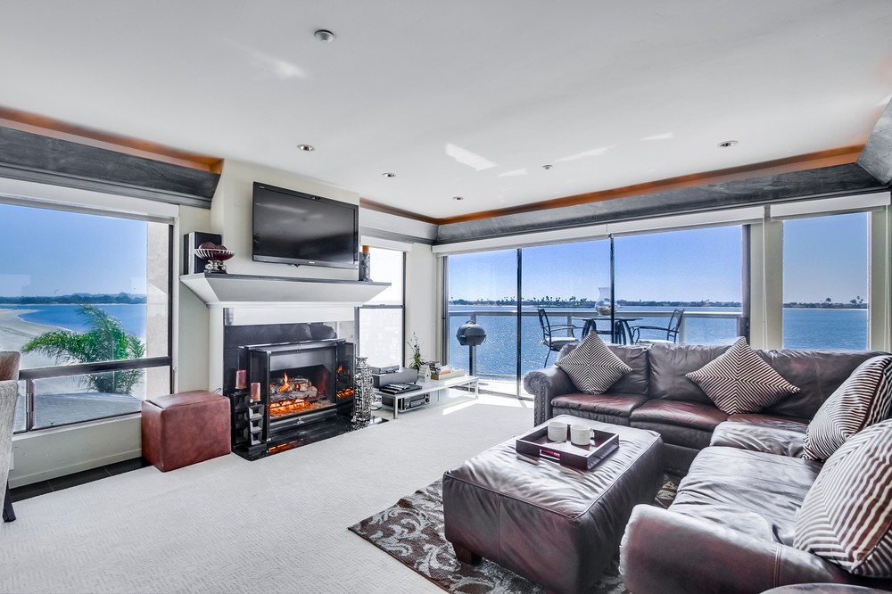 Living room with gas fireplace, TV and balcony with a view!