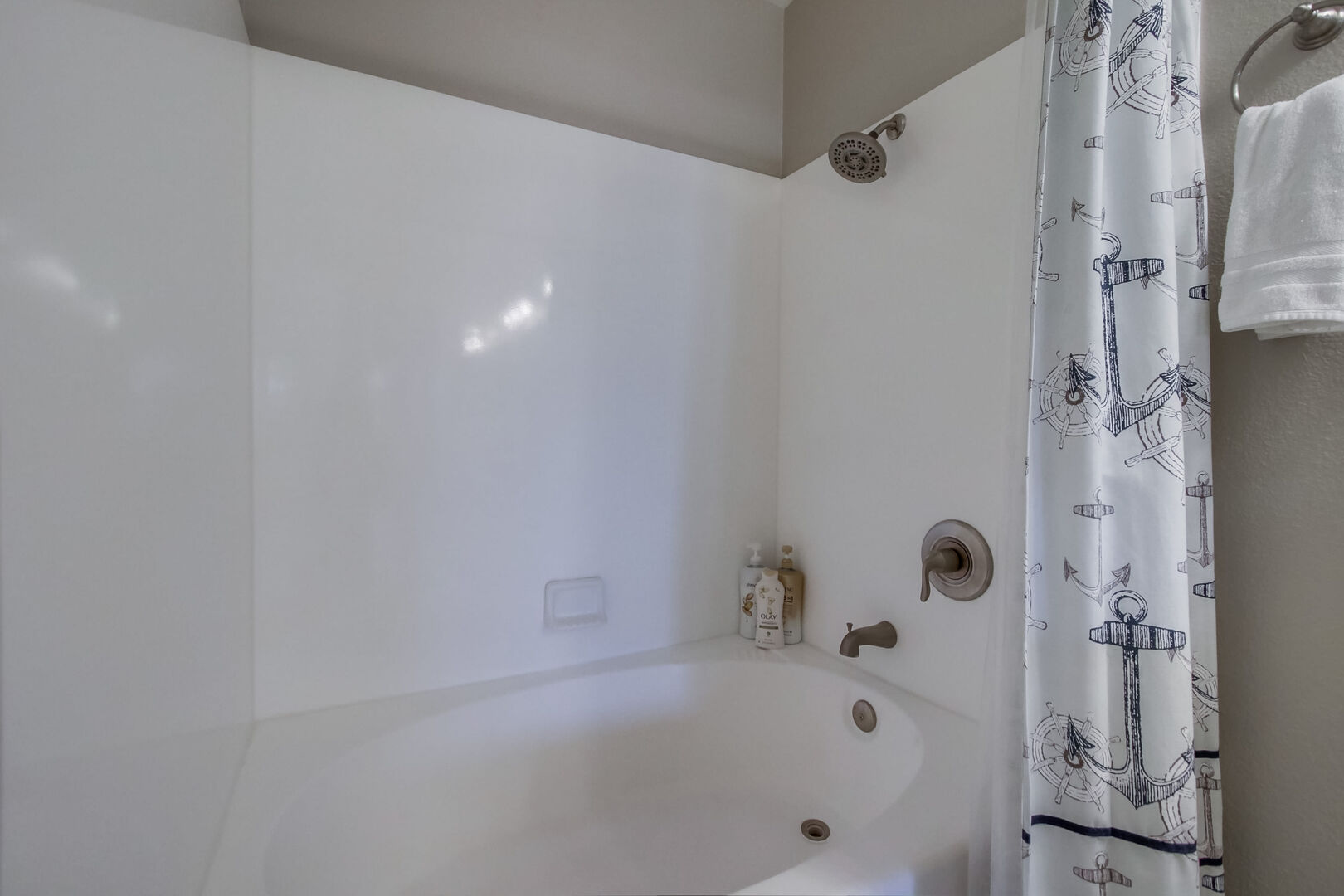 Shared bathroom with shower/ soaking tub, dual vanity, toilet, recessed lighting and storage cabinets