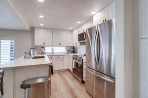 Beautiful stainless steel appliances, refrigerator, freezer, oven, stove, microwave, dishwasher, sink and ample storage space